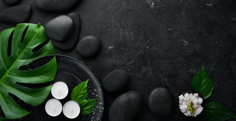 black_stones_candles_plants_in_spa